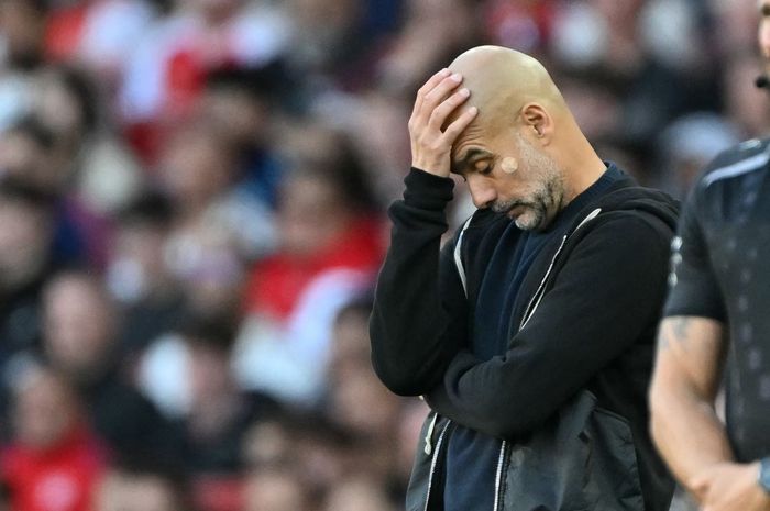 Reaksi Pep Guardiola dalam pertandingan Man City melawan Arsenal pada duel Liga Inggris di Emirates Stadium (21/9/2025).